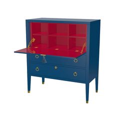 a blue chest with red glass top and gold trimmings on the bottom shelf