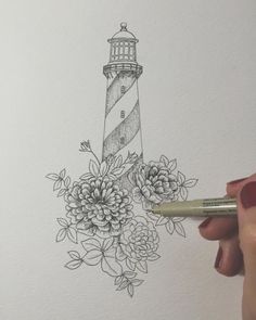 a drawing of a lighthouse with flowers on it