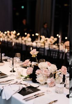 an image of a table setting with flowers and wine glasses on the table for a wedding reception