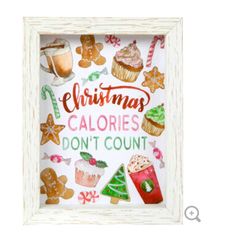 a white frame with some christmas decorations on it and the words, christmas calories don't count