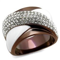 Description Ooze effortless glamour and elegance with this stunning two-tone women's stainless steel ring. Studded with several sparkling top-grade clear crystal stones, this white epoxy accented stainless steel band adds an extra layer of luxury to any outfit. Suitable for cocktail parties, soirees, and other occasions. Product Features: Stainless steel two tone ring Clear color top grade crystal stones Stone shape: round Stone setting: pave Two-tone light brown ion plated finish Ring size: women's 5 Weight (approx): 11.27 (g) Material(s): stainless steel/crystal/epoxy Product Specifications Weight Width Height Depth 0.02 LBS 3.00" 3.00" 3.00" Warning: CHOKING HAZARD-Small Parts Adult Supervision Required. Epoxy Crystal, Chest Jewelry, Two Tone Ring, Brown Rings, Chocolate Gold, Vintage Gold Rings, Luxe Jewelry, Trendy Fashion Jewelry, Stainless Steel Ring