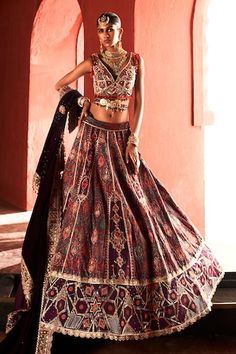 Dark purple jamawar lehenga featuring with applique embroidery highlighted with colorful beads and zari work over the border. Paired with a zari work embroidered padded blouse, velvet embroidered dupatta and a handmade belt with beaded tassels. - Aza Fashions Brocade Choli With Motifs For Reception, Bohemian Lehenga For Reception With Zari Work, Traditional Sets With Motifs For Reception, Bohemian Lehenga With Motifs For Reception, Bohemian Lehenga For Reception With Traditional Drape, Bohemian Traditional Wear For Reception And Festivals, Bohemian Traditional Wear For Festival Receptions, Bohemian Traditional Wear For Receptions And Festivals, Bohemian Anarkali Set With Zari Work For Reception