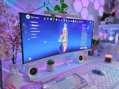 a computer monitor sitting on top of a desk next to a keyboard and mouse,