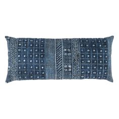 a blue and white pillow on a white background