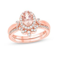 Set the stage for romance with this exquisite gemstone and diamond bridal set. Created in precious 10K rose gold, the engagement ring showcases a 7.0 x 5.0mm oval-shaped soft-pink morganite wrapped in a diamond halo. "V"-shaped diamond-lined collars flank the center. Completing her look, the wedding band shimmers with diamond-touched marquise shapes along the contour and diamonds along the shank. Captivating with 1/3 ct. t.w. of diamonds and a bright polished shine, this bridal set is ready to c Beautiful Bridal Jewelry, Crown Bridal, Diamond Frame, Bridal Engagement Rings, Diamond Bridal Sets, Pink Morganite, Rose Gold Metal, Gemstone Engagement Rings, Bridal Jewelry Sets