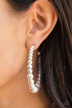 Gradually increasing in size at the center, a classy row of white pearls are threaded along an oversized hoop for a posh finish. Earring attaches to a standard post fitting. Hoop measures approximately 2 1/4" in diameter. Sold as one pair of hoop earrings. Paparazzi Fashion, Pink Jewels, Streets Of New York, 5th Avenue, 2021 Fashion, Pearl Hoop Earrings, Paparazzi Accessories, Rings For Girls, White Rhinestone