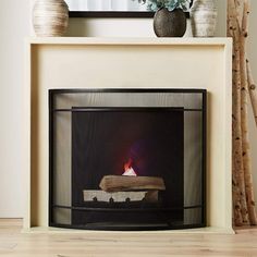 a fire place with logs on the mantle