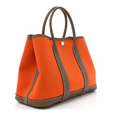 This is an authentic HERMES Toile Officier Negonda Garden Party 30 TPM in Feu and Etoupe. This is a beautiful Hermes tote crafted of vibrant orange canvas that is durable and strong. This is reinforced with brown leather including a solid leather base and side leather that extends into top rolled handles. There is a snap top closure and the interior is spacious. Hermes Tote, Hermes Garden Party, Birkin 25, Hermes Bags, Party Bags, Vibrant Orange, Garden Party, Brown Leather, Dust Bag