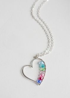 This open heart charm is made of sterling silver and I wire-wrap birthstone color crystals around the inside. <3 Each crystal can represent family, friends or whomever you like. This necklace is a great gift for yourself, mothers(to-be), sisters, etc. Each necklace is going to be completely custom made for you! :) The heart charm fits up to 7 crystals max. Each crystal represents birthstone color and is about 4mm. The pendant is approximately 37mm x 27mm. If you need more than 7 crystals, ple Sterling Silver Heart Charm Birthstone Necklace, Sterling Silver Heart Birthstone Necklace, Sterling Silver Open Heart Birthstone Necklace, Personalized Sterling Silver Birthstone Necklace With Heart Pendant, Sterling Silver Birthstone Necklace With Heart Charm And Pendant, Sterling Silver Birthstone Necklace With Heart Pendant And Charm, Sterling Silver Heart-shaped Birthstone Necklace, Silver Sterling Birthstone Necklace With Heart Cut, Silver Sterling Silver Heart Cut Birthstone Necklace