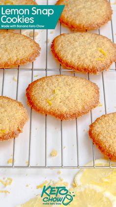 lemon snap cookies cooling on a rack with lemons in the background and text overlay that reads, lemon snap cookies