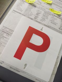 a close up of a parking sign with sticky notes on it