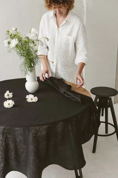 Looking to create lasting memories around the table? Set the stage for togetherness with our stunning round black linen tablecloth, adorned with delicate white blooms. Bring elegance to every mealtime! #diningdecor #familybonding #blacklinen #thingstories Ikigai Aesthetic, Wabi Sabi Living, Bohemian Lifestyle