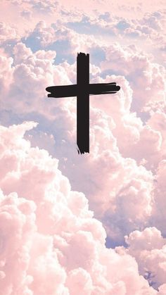 a cross in the middle of some clouds with pink and blue sky behind it, as seen from above