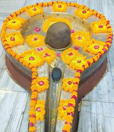 a large metal bowl with flowers on it