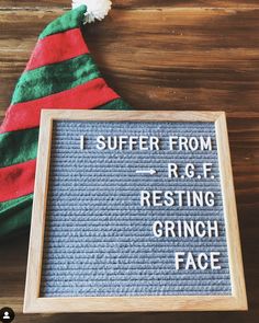 a sign that says i suffer from r g f resting grinch face next to a christmas hat