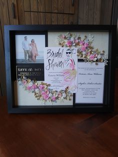 a wedding photo frame with flowers on it