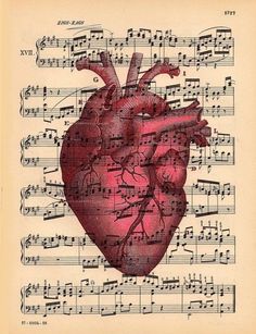 an old sheet music with a heart on it