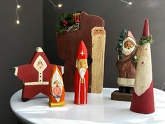 christmas decorations are sitting on a white table