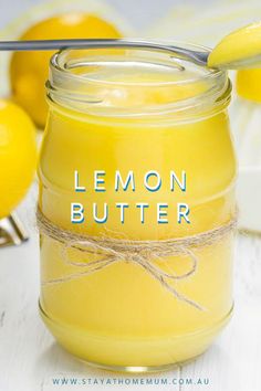 a jar filled with lemon butter sitting on top of a table