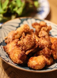 some fried food on a blue and white plate