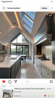 an open kitchen with skylights and white counter tops