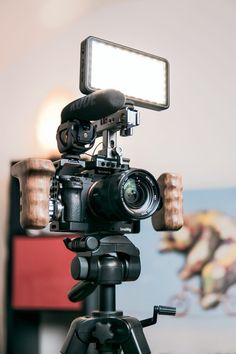 a video camera is set up on a tripod