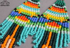 These colorful beadwork earrings are made of high-quality Czech beads and strong synthetic thread. They are elegant, fashionable, and highly versatile, suitable for everyday wear. Features: Sterling silver components Color: Gray, black, yellow, turquoise, blue, green, orange, red. This item is currently in stock. You must be completely satisfied. If you find merchandise unsatisfactory for any reason, return it within 10 days and your money will be refunded without questions. More beaded earrings Summer Orange Earrings With Tiny Beads, Colorful Beads Tassel Drop Earrings For Festival, Orange Tiny Beads Earrings For Festival, Multicolor Large Beads Summer Earrings, Multicolor Large Beaded Earrings For Summer, Orange Tiny Beaded Earrings For Festival, Festival Multicolor Tassel Earrings With Colorful Beads, Orange Beaded Dangling Earrings For Summer, Vibrant Handmade Beaded Earrings For Summer