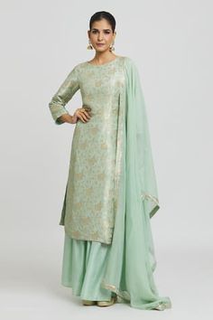 Mint green kurta in banarasi brocade silk base. Paired with a matching pleated silk gharara and an organza dupatta. Components: 3 Type Of Work: Floral Neckline: Round Sleeve Type: Three-quarter Fabric: Banarasi Brocade Silk Color: Green Occasion: Mehendi and Haldi - Aza Fashions Brocade Silk Suits, Banarasi Dupatta Suits Party Wear, Banarasi Dress Designs, Banarasi Kurti Design, Banarasi Dupatta Suits, A Line Kurti Designs, Silk Gharara, Dress Design Pakistani, Silk Dress Design