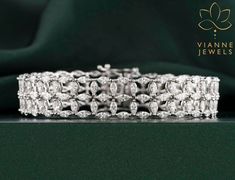 Experience the allure of sustainable luxury with our 9.13 TCW Marquise-Cut Lab-Grown Diamond Bracelet. Each meticulously selected diamond showcases the quintessential marquise cut, renowned for its boat-shaped elegance that elongates and flatters the wrist. Set in a harmonious design, these lab-grown diamonds not only mirror the brilliance and fire of natural diamonds but also represent a conscious choice for the modern aficionado. This bracelet is a testament to timeless beauty, ethical craftsmanship, and unparalleled sophistication. Perfect for both grand soirées or intimate celebrations, it promises to be a cherished addition to any jewelry collection. 💎 BRACELET Features: → Shape: MARQUISE CUT  → Carat: 9.13 TCW → Color: G+ → Clarity: VS+ As the listed ring is a custom order, there ma Marquise Diamond Bracelet, Diamond Mirror, Lasting Love, Wedding Jewelry Bracelets, Marquise Cut Diamond, 19 Days, Marquise Diamond, Marquise Cut, Wedding Bracelet