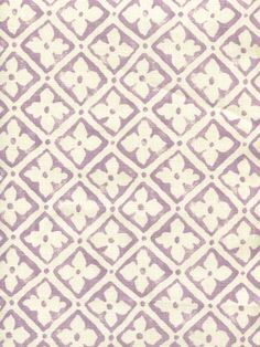 an old purple and white pattern on fabric