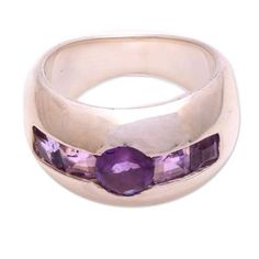 This alluring sterling silver ring from the Mutiara Collection catches the eye with its bold minimalism. This ring's faceted amethyst channel setting calls to mind a winking eye or a symbolic light you might see in the distance in a science-fiction story. Handmade with a high polish finish the lovely color scheme and striking design of this ring make it able to both stand out as an elegant accessory and blend in with outfits of any style. Modern Amethyst Ring As Gift, Modern Amethyst Round Rings, Modern Amethyst Rings, Modern Sterling Silver Amethyst Ring For Formal Occasions, Modern Amethyst Anniversary Ring, Modern Amethyst Rings In Round Shape, Modern Silver Amethyst Ring For Anniversary, Modern Amethyst Promise Ring, Modern Purple Amethyst Rings