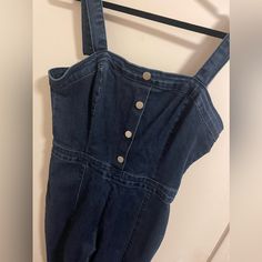 Size Large. Blue Denim Color. Brand New, Never Worn, Tags Attached. Zipper Back And Back Pockets. 34” Inseam. Stretch. Button Up Front Detail. Cheap Dark Wash Button-up Denim Jumpsuit, Denim Color, Denim Jumpsuit, Colored Denim, Pant Jumpsuit, Blue Denim, Button Up, Pants For Women, Jumpsuit