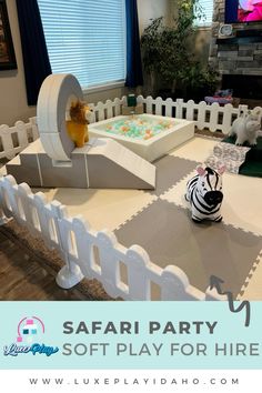 a zebra themed birthday party with cake and toys on the table for children to play in