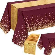 the table cloth has gold dots on it and is maroon with gold trimmings