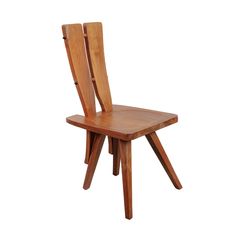 a wooden chair sitting on top of a white floor