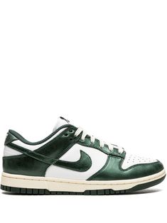 Dunk Low "Vintage Green" sneakers from NIKE featuring dark green, white, leather, signature Swoosh logo detail, embroidered logo to the rear, round toe, front lace-up fastening, logo patch at the tongue, branded insole and rubber sole. These styles are supplied by a premium sneaker marketplace. Stocking only the most sought-after footwear, they source and curate some of the most hard to find sneakers from around the world.. | Nike Dunk Low "Vintage Green" sneakers Shoe Plug, Classy Colors, Nike Tenis, Denim Baby, Dr Shoes, Earthy Outfits, Sports Aesthetic, Green Sneakers, Nike Brand