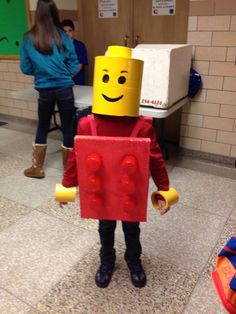 a child in a costume made to look like a lego man