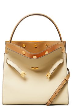 Inspired by and named for late style icon Lee Radziwill, this satchel is a study of contrasts with its mixed leather and soft, yet structured shape. Its multicompartment design can be snapped in different ways or left open, which is meant to conceptually mimic an unfolding outerwear collar. Structured silhouette with flat base for stability Cotton lining Leather Imported Designer Tan Satchel With Removable Pouch, High-end Tan Leather Satchel, High-end Beige Bag With Leather Lining, Designer Cream Bag With Leather Lining, High-end Top Handle Satchel With Leather Lining, Designer Calf Leather Satchel With Gold-tone Hardware, Designer Cream Leather Satchel, Lee Radziwill, New Moon