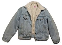 CLASSIC LEVIS TRUCKER SHERPA LINED JEAN JACKET IN A LIGHT ACID WASH SIZE 38 (MENS SMALL) = 21' ACROSS CHEST LAID FLAT X 26" LENGTH TOP OF SHOULDER TO HEM (THESE ARE DESIGNED TO SIT A BIT SHORTER THAN A STANDARD JACKET WOULD) Featuring: a full signature snap front closure, sherpa collar and full lining, chest pockets with snap flap closures, hip pockets, snap sleeve cuffs, and back snap tabs. Original retail price $128.00 - BUT YOU WON'T FIND ANY THAT LOOK LIKE THIS ONE ON THE SHELVES TODAY! Lined Jean Jacket, Denim Sherpa Jacket, Lined Jeans, Sherpa Jacket, Denim Jean Jacket, Sherpa Lined, Denim Jean, Acid Wash, Chest Pocket