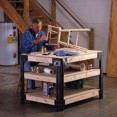 a man is working on something with wood and glues in his hand while sitting at a workbench