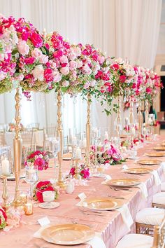 an image of a table setting with pink flowers on the centerpieces and place settings