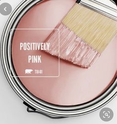 a pink paint can with a brush in it and the words positively pink