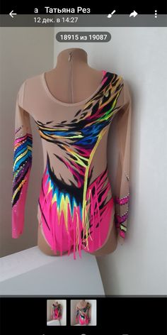 a woman's bodysuit with colorful feathers on it