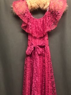 Beautiful long rose pink lace dress with ruffled top bowtie finish on the back, zipper closure best fit for size medium 4 to 6 measurements up to 36B chest, 28 inch waist ,can be tied smaller,upto 20 hips,will add length ,) Lined, could be cut and sewn into a short line so you can see through the ladies that would be pretty, *note that the elastic at the ruffle on the chest is white so you can see through to that Bohemian Lace Dress, Pink Lace Dress, Dress Bohemian, Lace Pink Dress, Bohemian Maxi Dress, Ruffled Top, Lace Dress Long, Bohemian Dress, Long Maxi