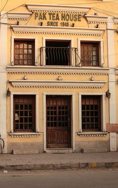 an old building with two bicycles parked in front