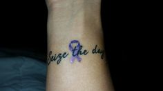 a woman's wrist with a purple ribbon on it that says, believe be day