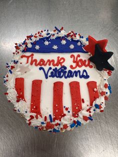 a red, white and blue cake with the words thank you veterans written on it