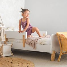 A sturdy bed built just for toddlers with playful curves and modern shapes to smooth the meaningful transition into “a real bed.” The low profile and two removable rails provide a safe and comfortable sleeping place that helps your active toddler easily get in and out of bed. This high-quality bed fits a standard crib mattress and brightens any decor with a pop of modern design. Low Toddler Bed, Kids Bed Design, Winter Newborn, Toddler Bed Set, Bassinet Sheets, Baby Sleep Sack, Toddler Beds, Kids Bedding Sets, Wood Bed Frame