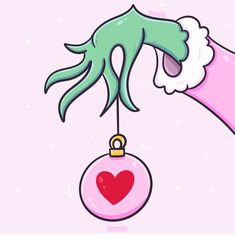 an octopus hanging from a pink ornament with a heart on it's string