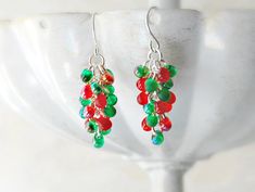 "Christmas Earrings-Red and Green \"Holly and Ivy\" Can you believe we are approaching the holiday season already? Get in the holiday spirit with these cheery, cluster Christmas earrings. These festive earrings are perfect Christmas accessories. They dangle approximately 1.5 inches. If you are looking for a small stocking stuffer or Christmas gift, look no further! Have another color combination in mind, message me to discuss options! Nickel and lead-free hooks. ☼ ☼ ☼ ☼ ☼ ☼ ☼ ☼ ☼ ☼ ☼ Earrings in Red Christmas Earrings For Holiday, Red Earrings For Christmas Holiday, Holiday Multicolor Earrings Perfect For Gifts, Holiday Multicolor Earrings As A Gift, Red Earrings For Holiday And New Year, Holiday Multicolor Earrings As Gift, Red Earrings For New Year's Holiday, Multicolor Earrings For Holiday Gifts, Red Earrings For New Year Holiday